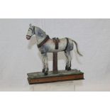 Late 19th / early 20th century model of a horse in harness with articulated legs and mounted on a