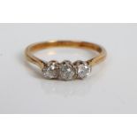 Diamond three stone ring with three old cut diamonds mounted on yellow metal shank, stamped - 18ct.