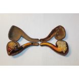 Late 19th century meerschaum pipe carved in the form of a Negro head, with amber mouthpiece, 14cm,