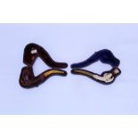 Finely carved and stained meerschaum cheroot holder in the form of an eagle claw holding a cup,