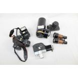 A quantity of cameras and photographic equipment - including Fujica and Praktica 35mm SLRS,