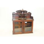 Early 20th century walnut smokers cabinet superstructure pierced for pipes,