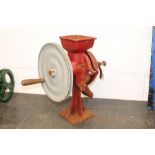 Table-top grinding mill in red livery
