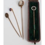 Victorian diamond set stick pin in box and three other stick pins (4)