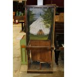 Antique slot machine cabinet with painted big top panorama, various inscribed to back panel,