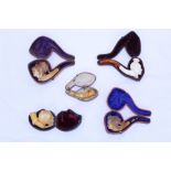 Group of five novelty carved meerschaum cheroot holders - to include example carved as a hand