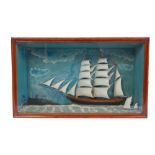Old ships' diorama depicting three-masted ship and two small, in glazed case,