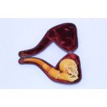 Rare 19th century novelty carved meerschaum cheroot holder carved as a hand holding a skull,