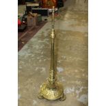 Victorian brass standard lamp - the flared knopped column on circular spread base and projecting