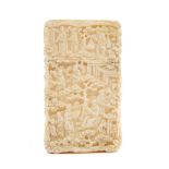 19th century ivory card case with detailed carved decoration of people against a foliate background,