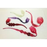 Five 19th century Nailsea-type glass pipes - including cranberry, purple,
