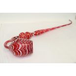 Massive 19th century Nailsea cranberry glass pipe with white drawn glass ornament,