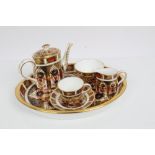 Royal Crown Derby Imari miniature tea set - comprising oval tray, teapot, cup, saucer,