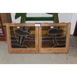 Set of four stained and painted glass windows - each depicting river landscapes, wooden frames,