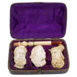 Late 19th century set of three meerschaum cheroot holders carved in the form of two bearded men and