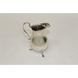 Late Victorian silver cream jug of baluster form, with scroll handle,