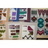 Good quantity of embroidered stitch samplers, worked on canvas and mounted for display,