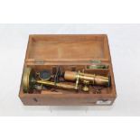 19th century field microscope with accessories in a mahogany case