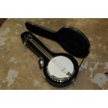 Osark six-string banjo with Remo Weatherking banjo head, in a hard carrying case,