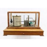 Negretti & Zambra barograph in a stained wood case with bevelled glass panels