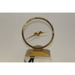 1950s American Jefferson Golden Hour electric clock of circular form, with transparent dial,