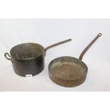 Three large 19th century copper saucepans with iron handles,