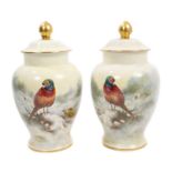 Good pair of hand-painted Coalport vases and covers decorated with game birds in snowy landscapes