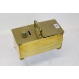 Victorian brass 'honour' tobacco box with coin slot and surmounting handle,
