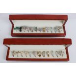 Collection of silver gem set dress rings in two display boxes