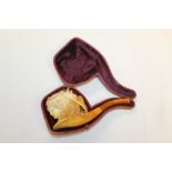 Late 19th century meerschaum pipe carved with a lady's' head wearing a floral hat within ribbons,