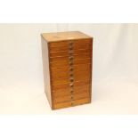 Small twelve-drawer wooden chest containing sewing accessories, buttons, threads, tools,