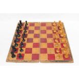 Jaques-style Staunton pattern ebony and boxwood chess set with king side rook and castle,