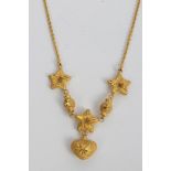 Chinese yellow metal necklace decorated with stars and a heart pendant CONDITION REPORT