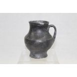 Roman pottery jug of baluster form, with strap handle, oxidised glaze,