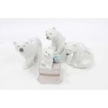 Three Lladro porcelain polar bears and another dog ornament,
