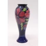 Moorcroft Pottery vase decorated in the Anemone pattern on blue ground - impressed and painted