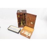 19th century brass microscope with accessories, in a fitted mahogany case,