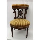 Extremely rare mid-Victorian walnut and ebonised smokers chair - the cushion upholstered top rail