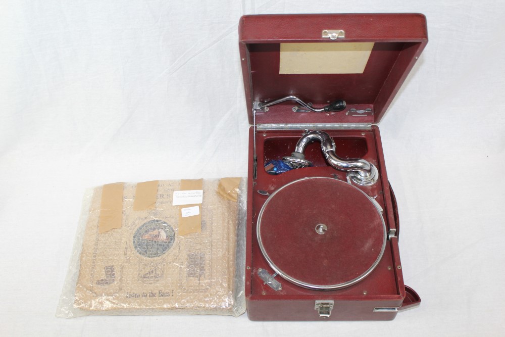 Early 20th century portable wind-up gramophone in a maroon case,