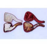 Two cased late 19th / early 20th century meerschaum pipes - both carved with Turkish heads,