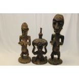 Three Old African carved wooden female fertility figures - two with bead and shell decoration,