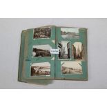 Postcards in album - mainly topographical - including real photographic, landmarks, street scenes,