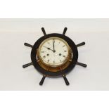 Schatz 'Royal Mariner' ships' bulkhead clock striking eight bells, mounted in a ships' wheel frame,