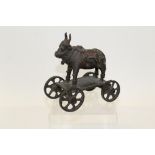 Indian bronze of a sacred bull, on a four-wheeled base,