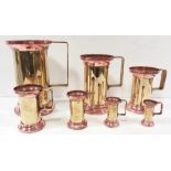 Set of 7 Copper & Brass Graduated Tankers