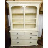 A 4' 2" late 19th Century two part painted pine dresser with decorative moulded cornice, two shelf