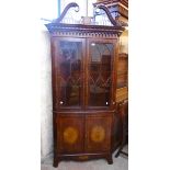 A 3' Chippendale style inlaid mahogany corner cabinet with fretwork broken swan neck pediment,