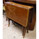 An early 20th Century mahogany cross banded and strung Sutherland table with flanking fretwok