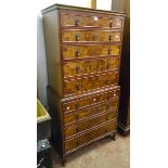 A 32" reproduction mahogany and figured veneered chest on chest with flight of nine graduated