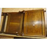 A pair of 36" 1920's walnut single bedsteads with panelled headboards and curved foot boards